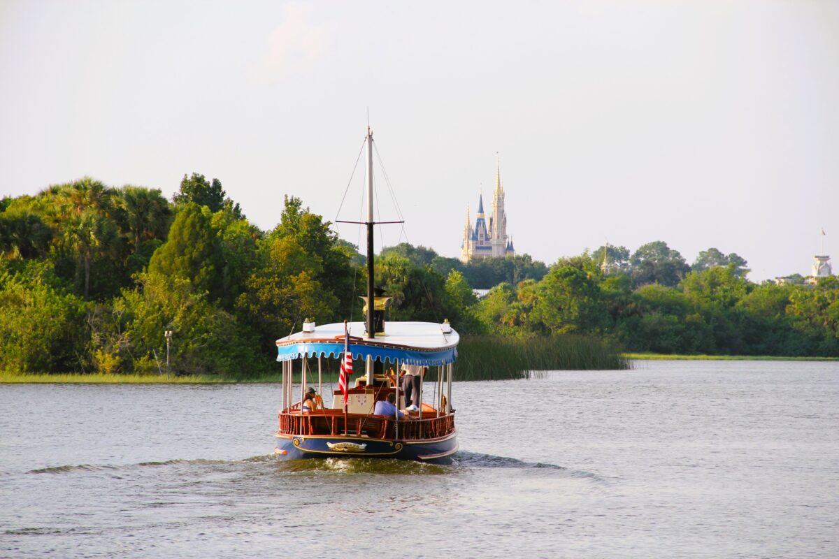 Disney boat sailing towards Magic Kingdom and Cinderella Castle